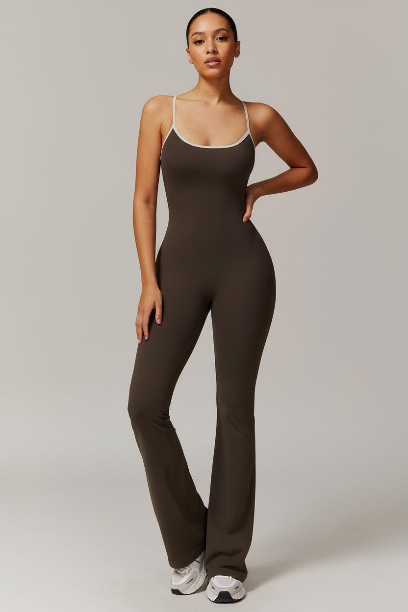 Person wearing a brown jumpsuit on a plain background